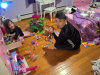 1/16 - Chris got pulled in to play with the dolls.