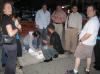 6/17 - For Kevin's brithday we tried to surprise him at his restaurant. Here we are lighting the candles down the block on the sidewalk.